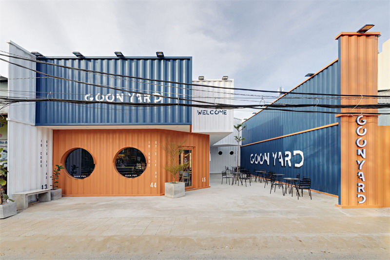 Container Cafe | The polygonal structure creates a courtyard building, with round windows like cabins.
